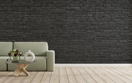 Industrial black brick wallpaper mural transforming a living space into a striking first impression.