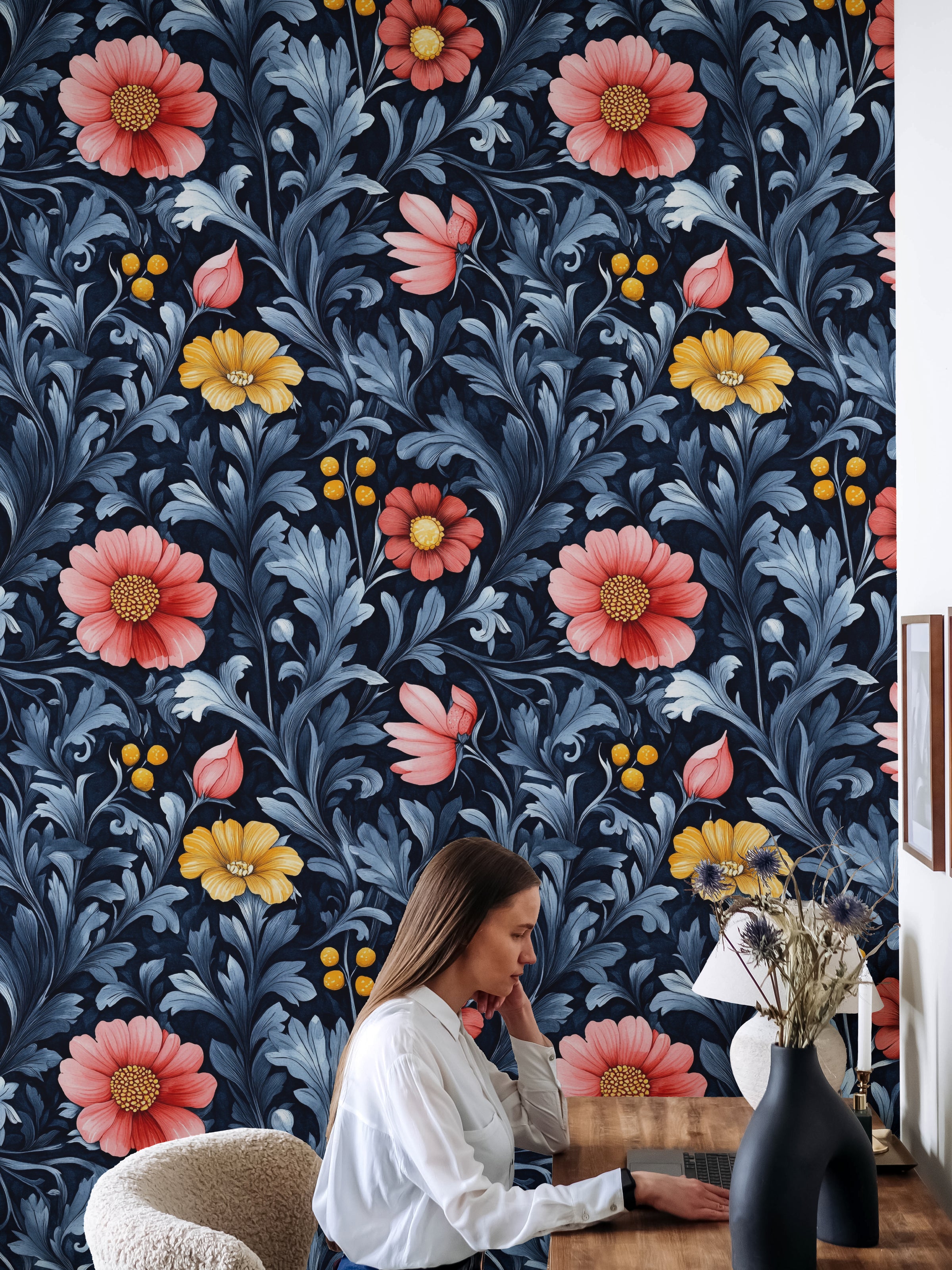 Home office floral wallpaper with deep navy leaves and bold coral flower accents