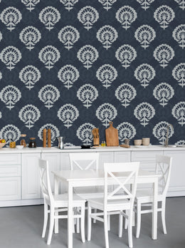 Deep blue damask wallpaper creates rich statement backdrop in sophisticated dining room interior