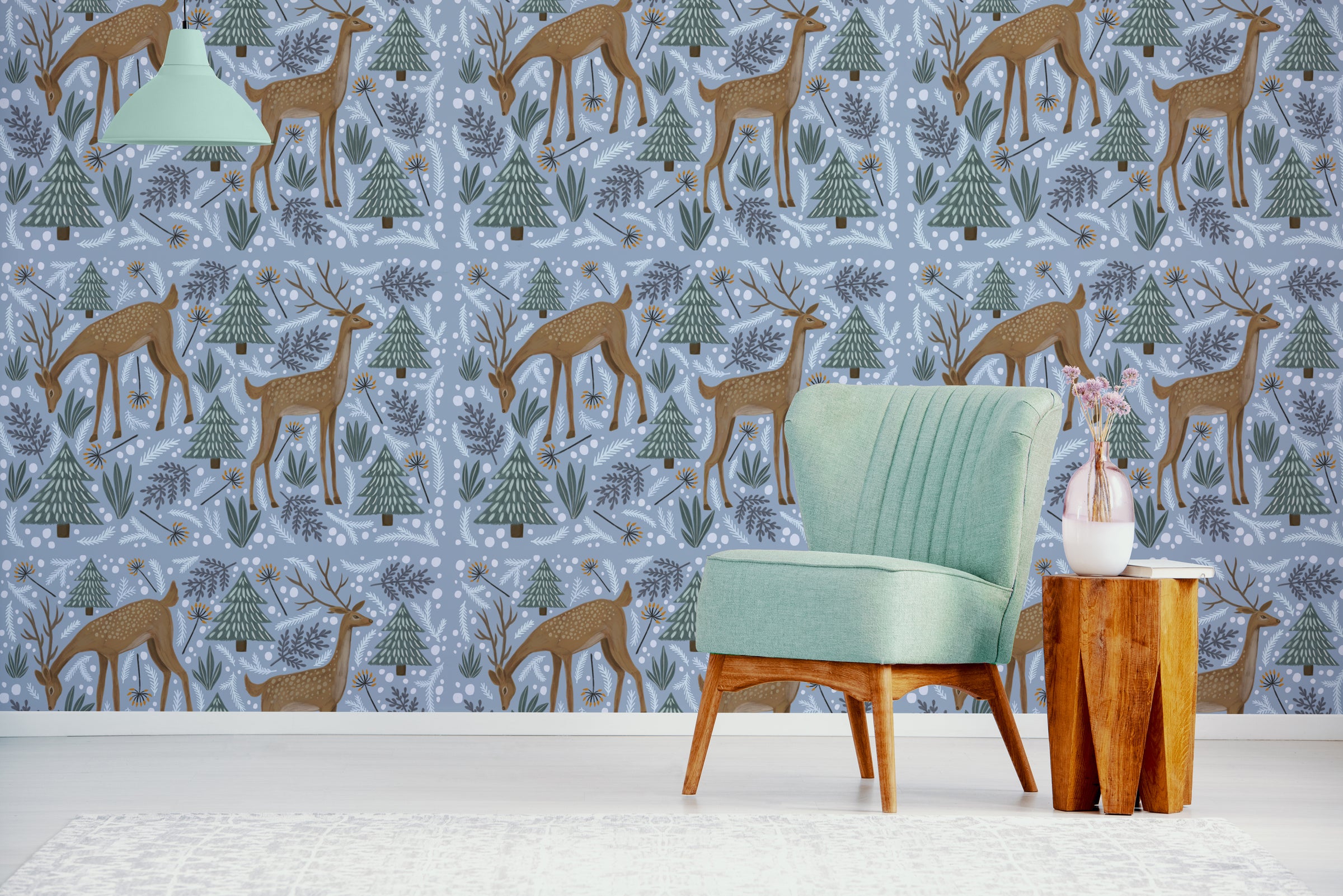 Blue woodland deer wallpaper with pine trees creates calming nursery accent wall