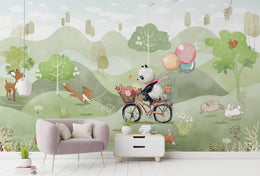 Nursery wall mural showing cute animals, rolling hills, and playful pastel nature design