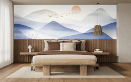 Striking blue mountain mural with golden birds, creating a powerful guest room wall impact.