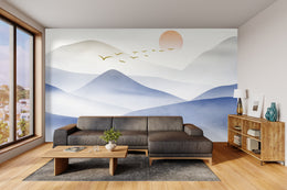 Blue gradient mountain wallpaper with sunlight highlights, energizing contemporary living room walls.