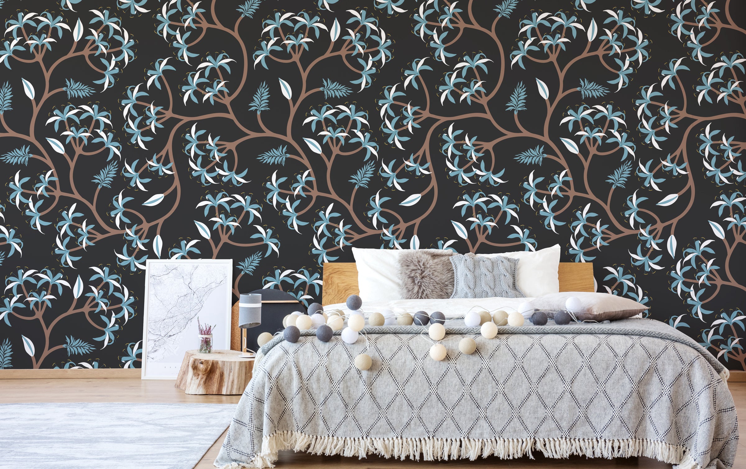 Elegant bedroom accent wall featuring black background blue leaf botanical pattern, cozy interior styling