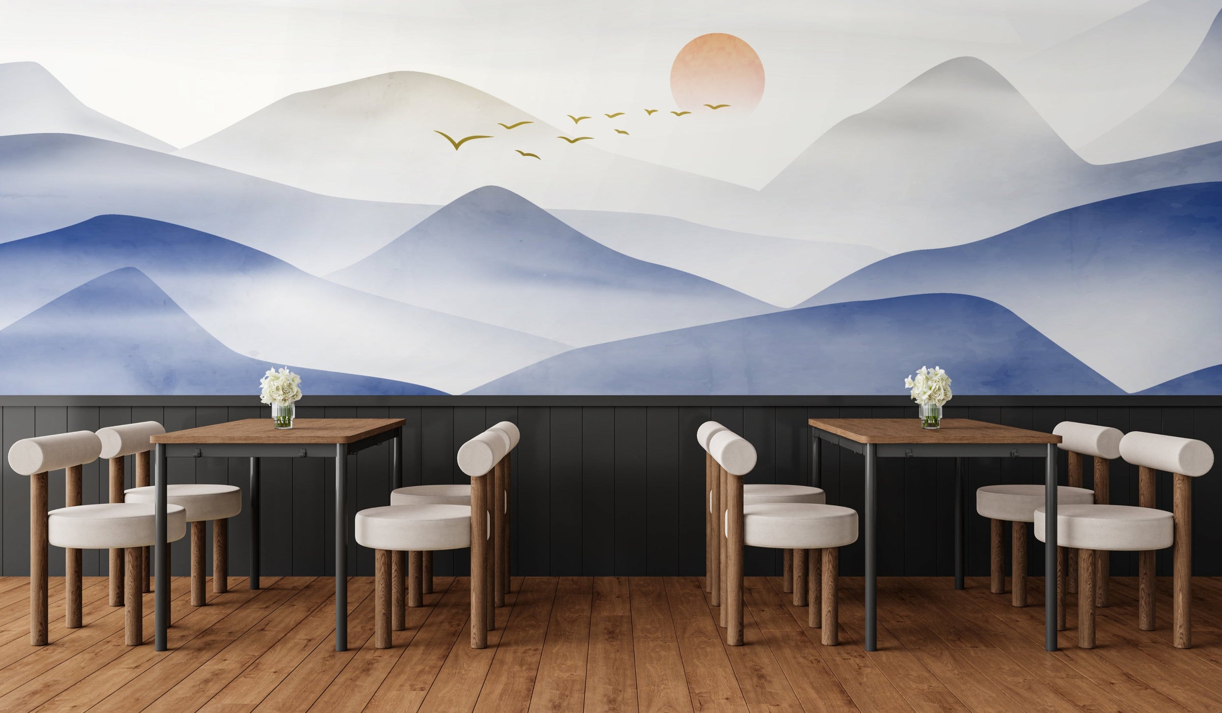Bold blue mountain mural with golden sunrise, energizing modern cafe walls.